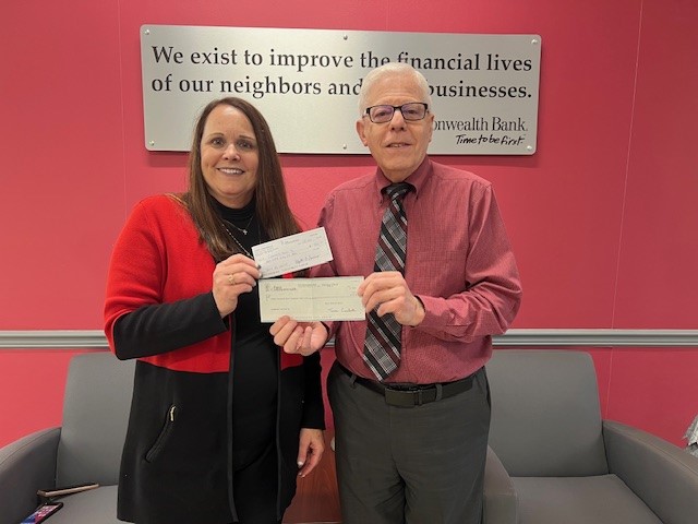 (Pictured l to r:) Dawn Martin presented checks to Robert A. Cardamone totaling $3,835 in 
community donations received and a matching $3,835 gift from First Commonwealth Bank from 
their recent “Share the Warmth Campaign”.